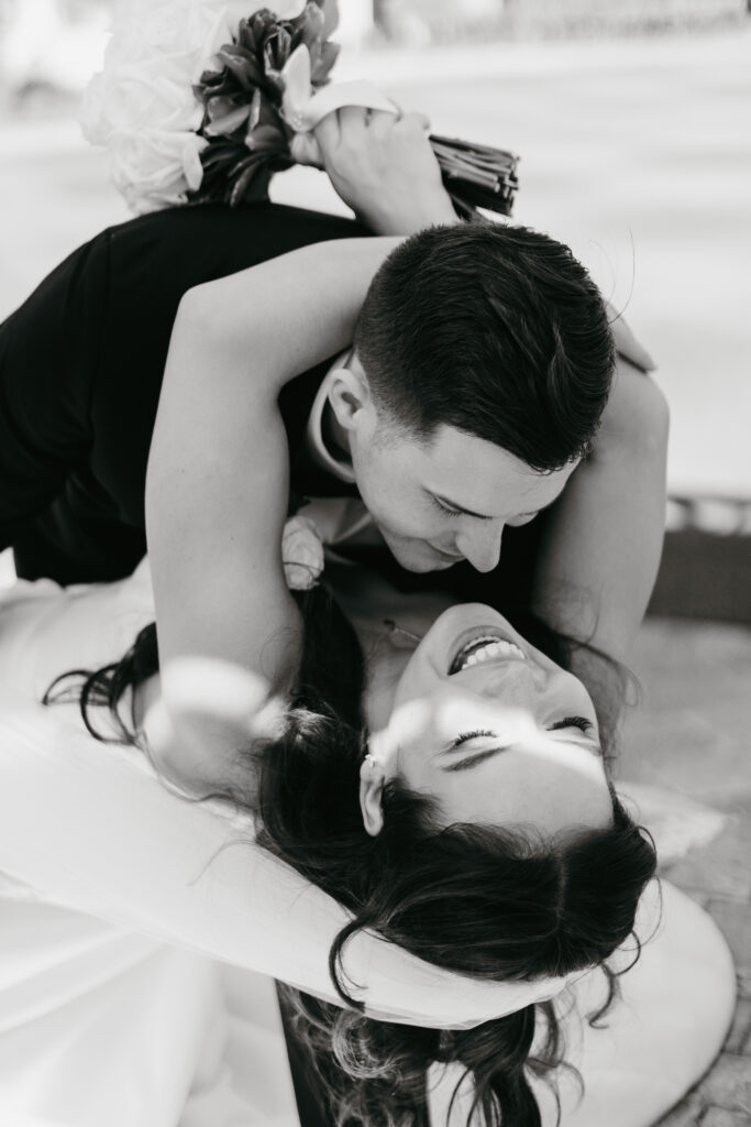 Bride and groom happily in love during bridal portraits during their wedding at Heritage Bay Golf and Country Club in Naples, Florida. 