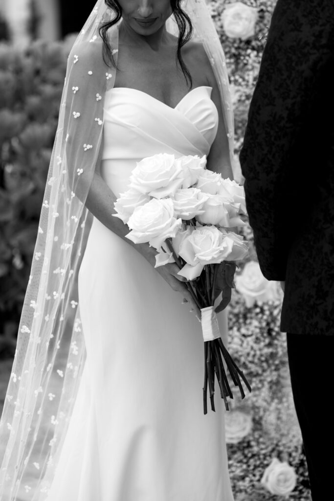 Bride's flowers during ceremony at Naples Bay Resort. 