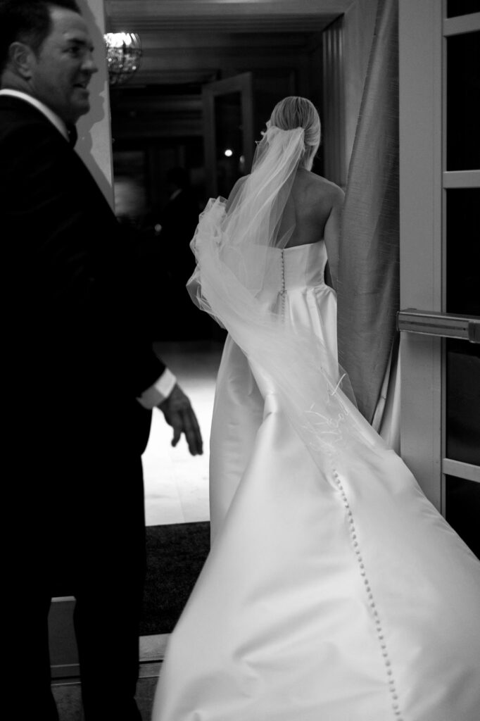 Bride and groom walking through the Ritz Carlton in Naples, Florida, taken by Priscila Del Cristo Photo