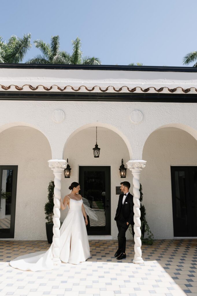 Bride and groom holding hands before their Alderman House wedding ceremony