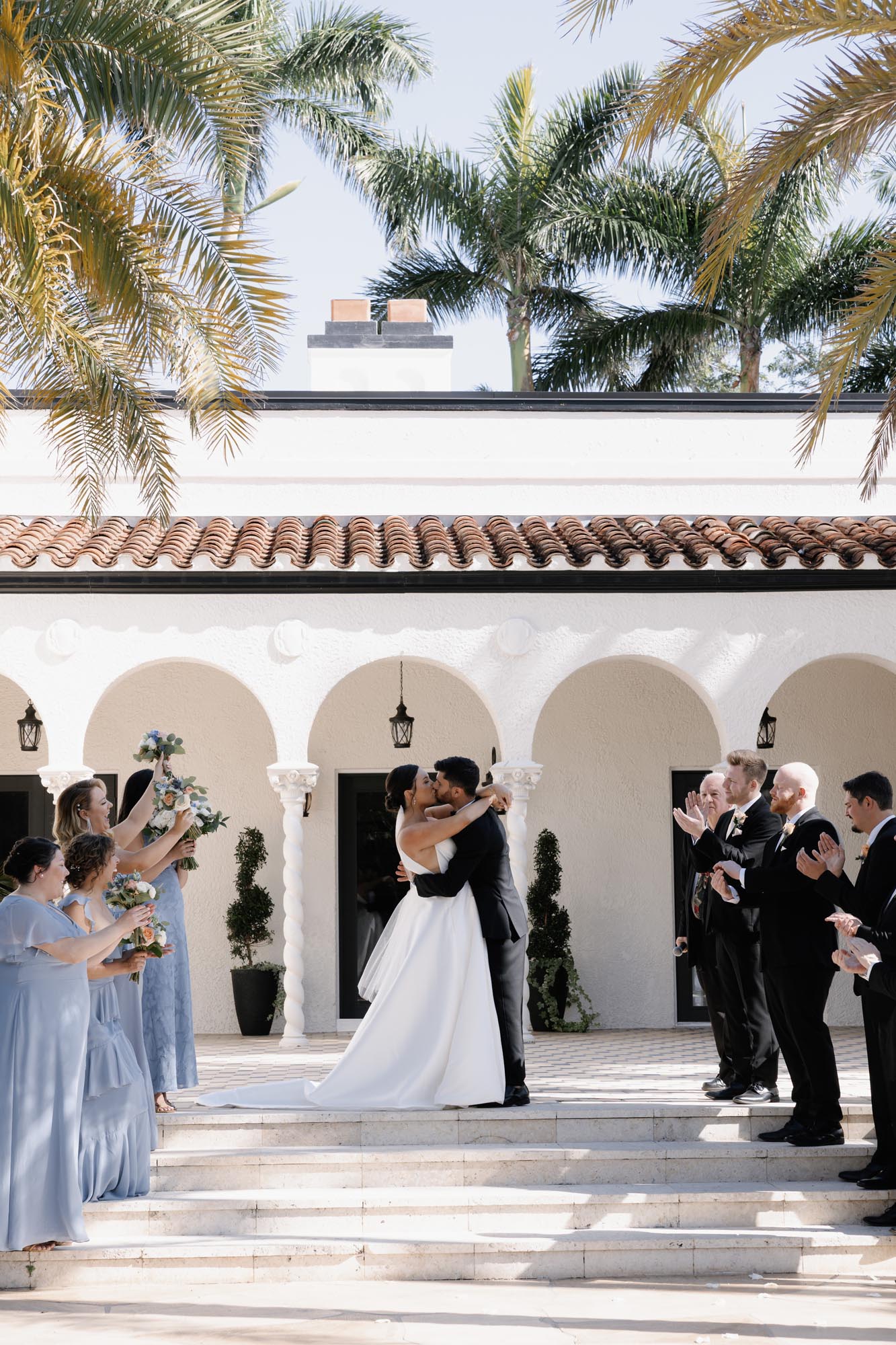 Bride and groom kissing at their ceremony at The Alderman House Wedding Venue in Fort Myers, Florida