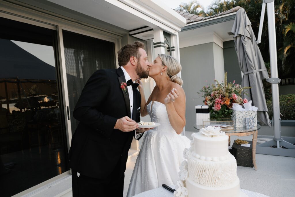 Romantic Port Royal Naples FL Wedding | Priscila Del Cristo Photo Kissing after cake cutting in port royal naples florida.