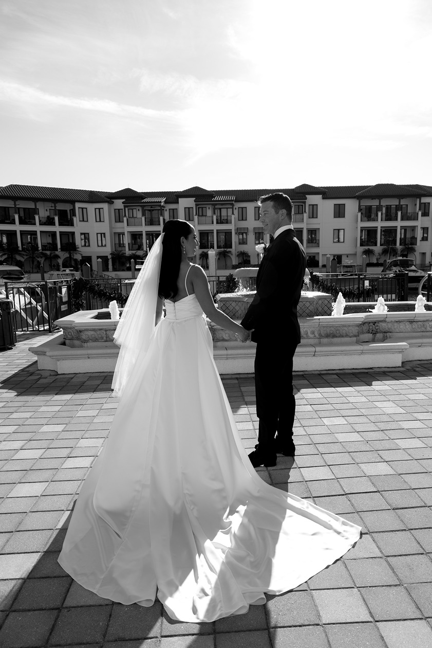 the bride and groom at their naples beach hotel wedding