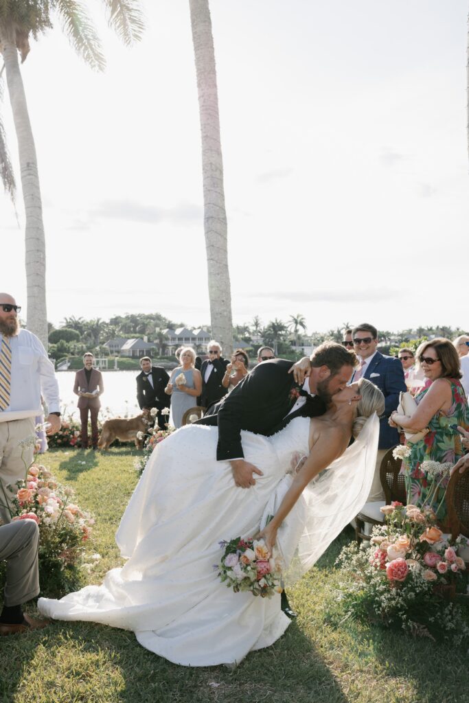 bride and groom kissing after getting married in florida during one of the best times to get married in florida, summer