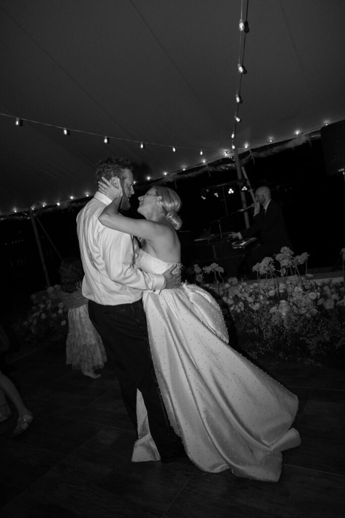bride and groom dancing at their evening reception during the best time to get married in florida, summer