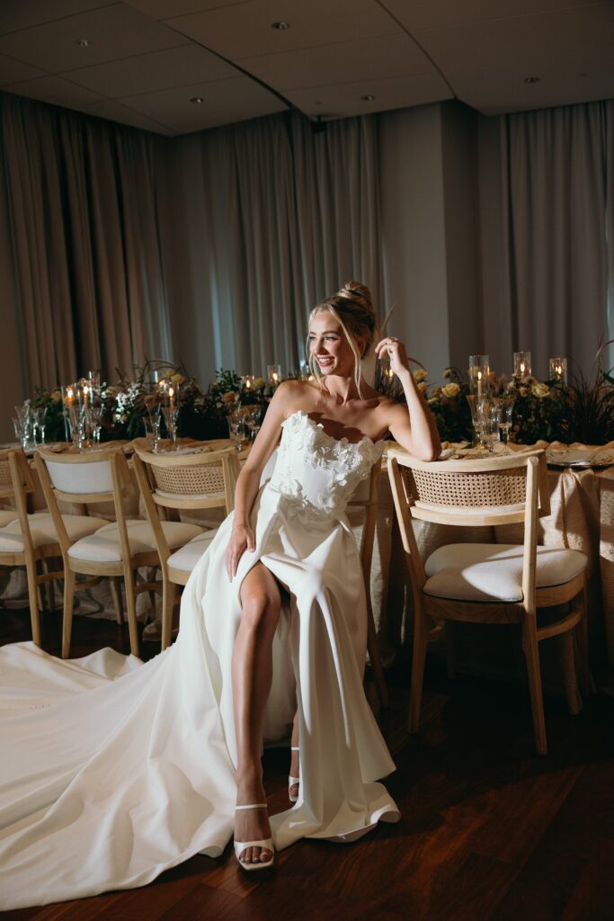 bride smiling during her portrait session inside her elegant wedding reception venue during one of the best times to get married in florida, december
