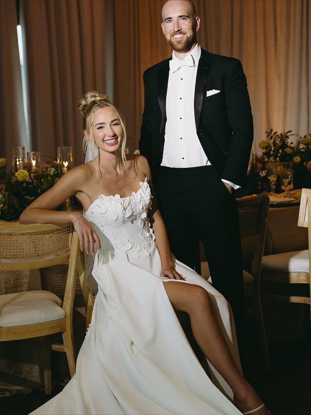 bride and groom smiling during their portrait session inside her elegant wedding reception venue during one of the best times to get married in florida, december