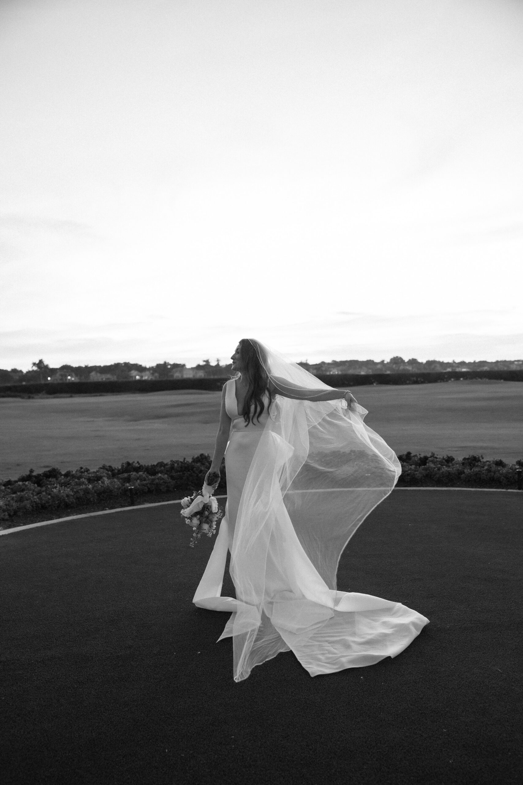 black and white bridal portait on the lawn at one of the best outdoor wedding venues in naples, fl