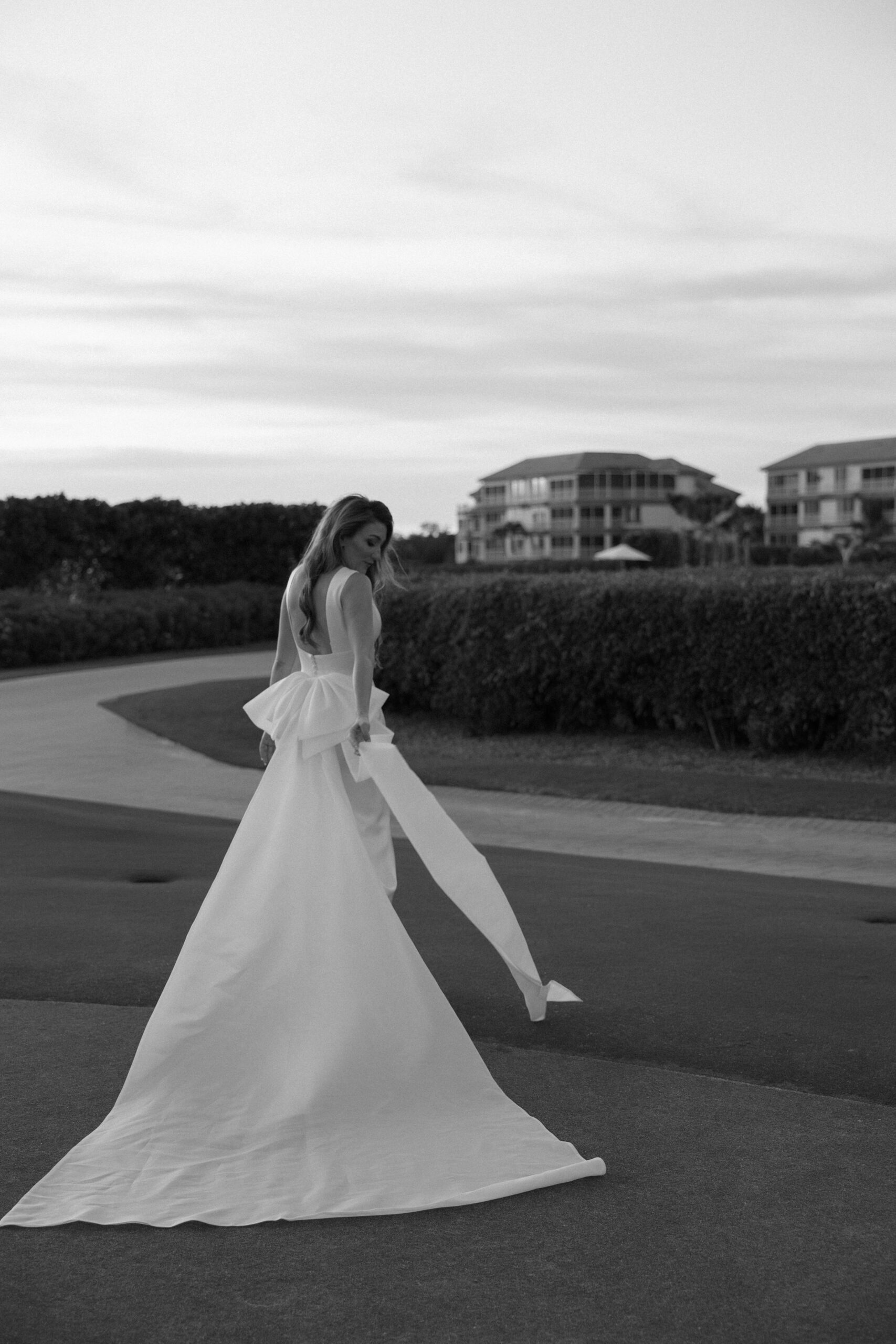 black and white bridal portraits on a lush lawn at one of the best wedding locations in naples, fl