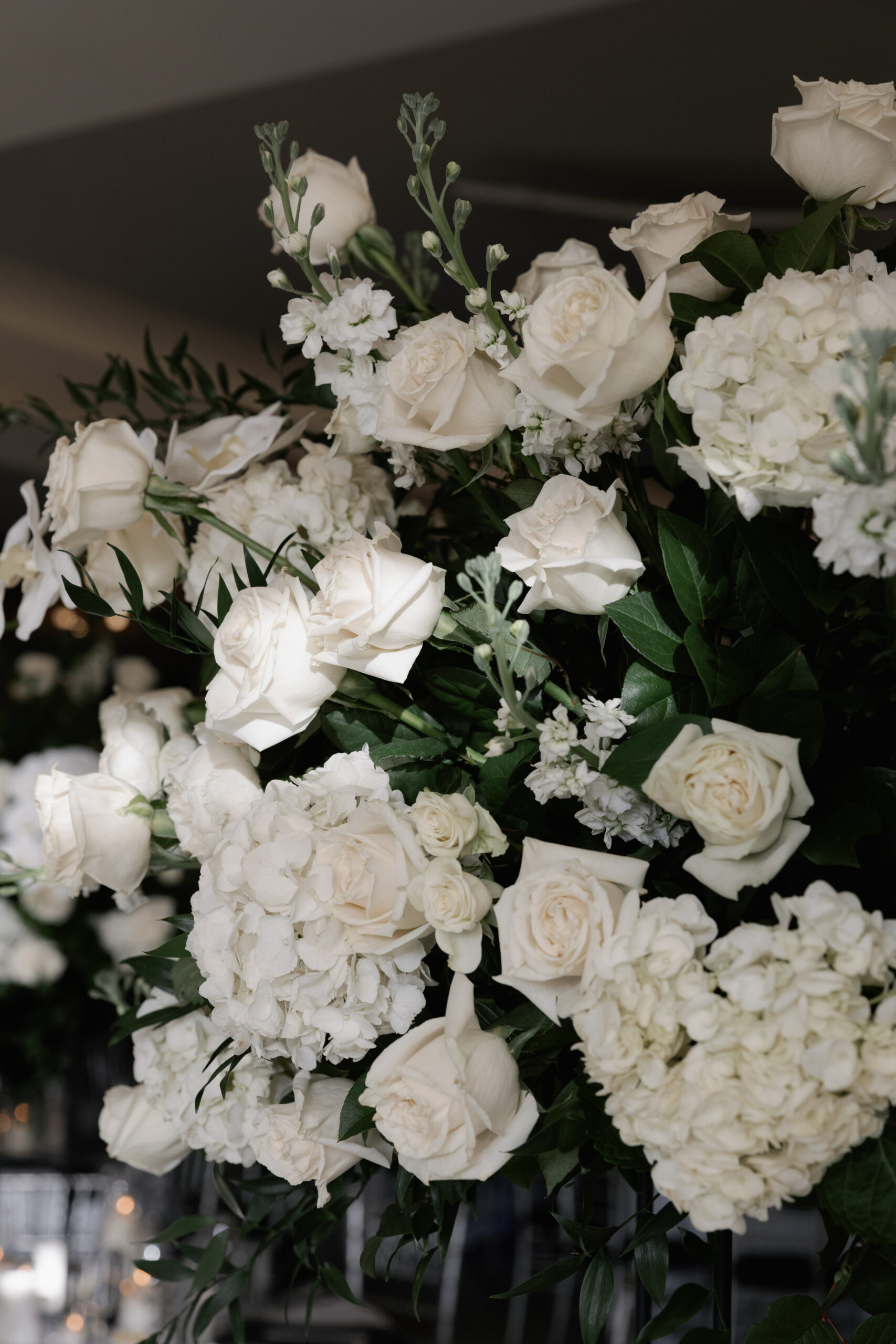 closeup of crisp white roses setup at a naples wedding by one of the best florists in the area