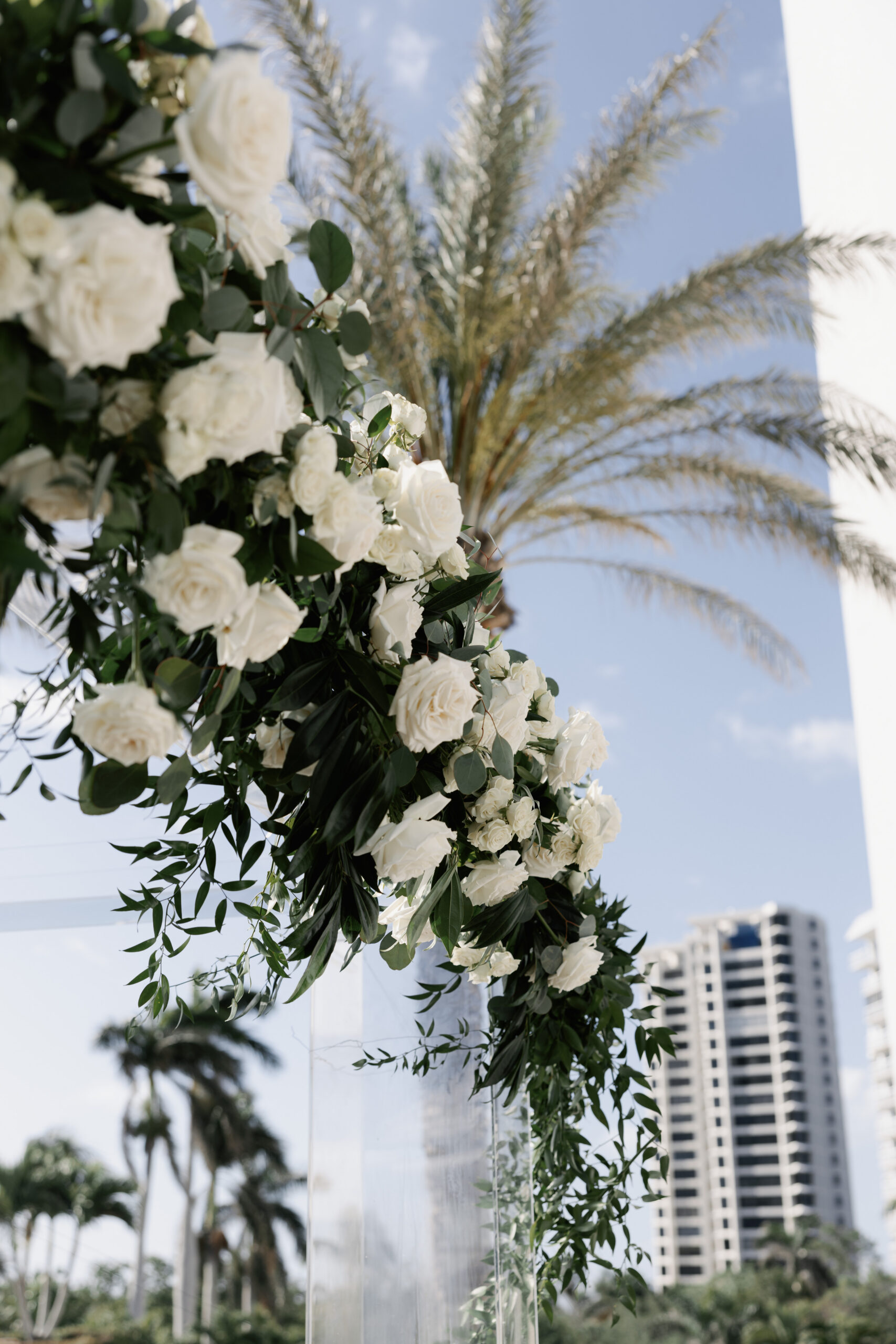 crisp white and green floral arrangement by one of the top naples wedding florists