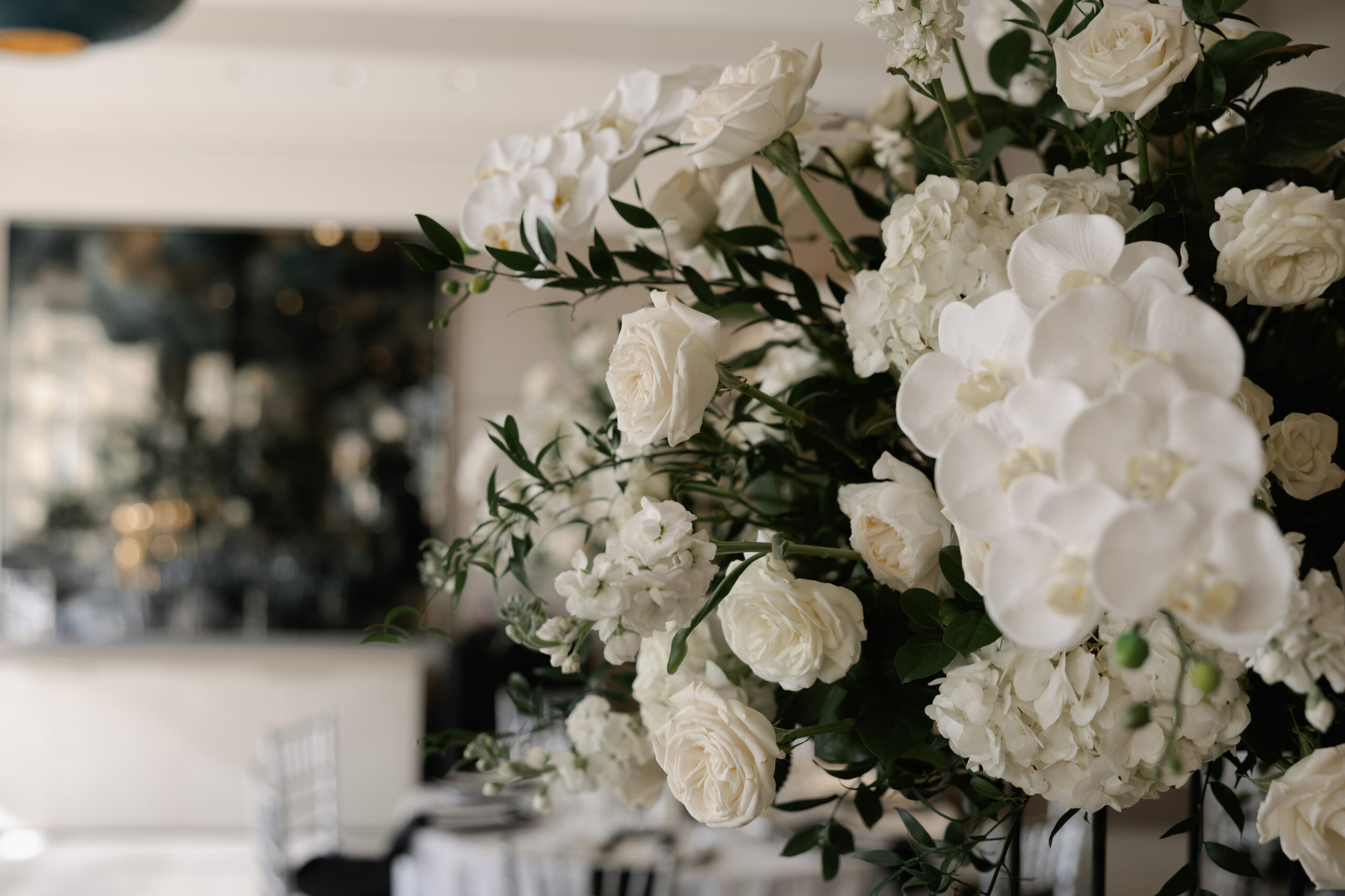 closeup of white floral arrangements done by one of the most sought after naples wedding florists
