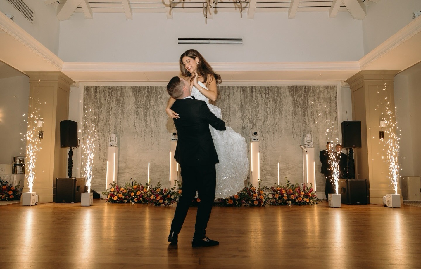 flower arrangements in the reception space of a naples wedding by one of the top naples wedding florists