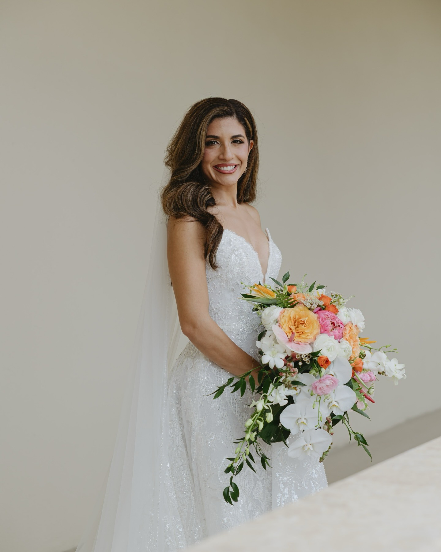 portrait of a bride with her bouquet put together by one of the top naples wedding florists
