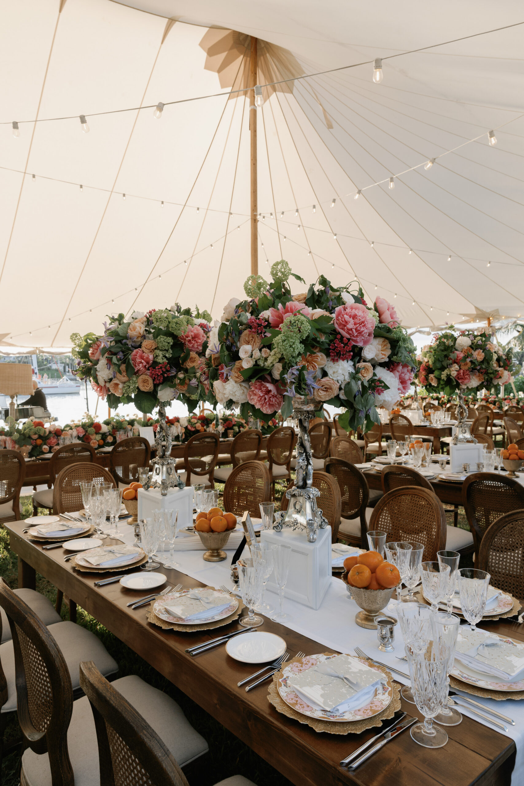 wedding reception long table floral arrangements done by the best wedding florist in naples fl