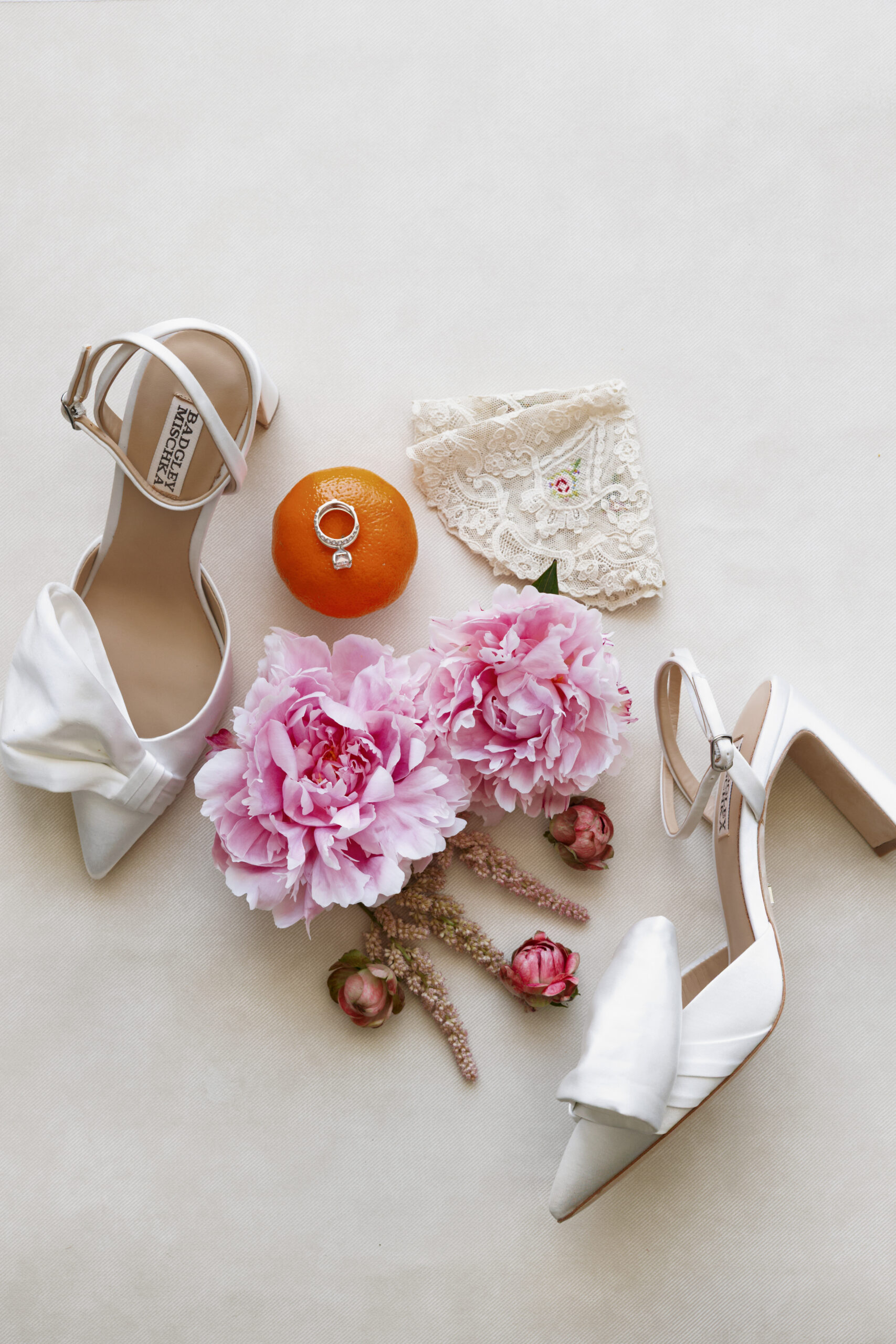 detail shot of bridal shoes and flowers by the top wedding florists in naples