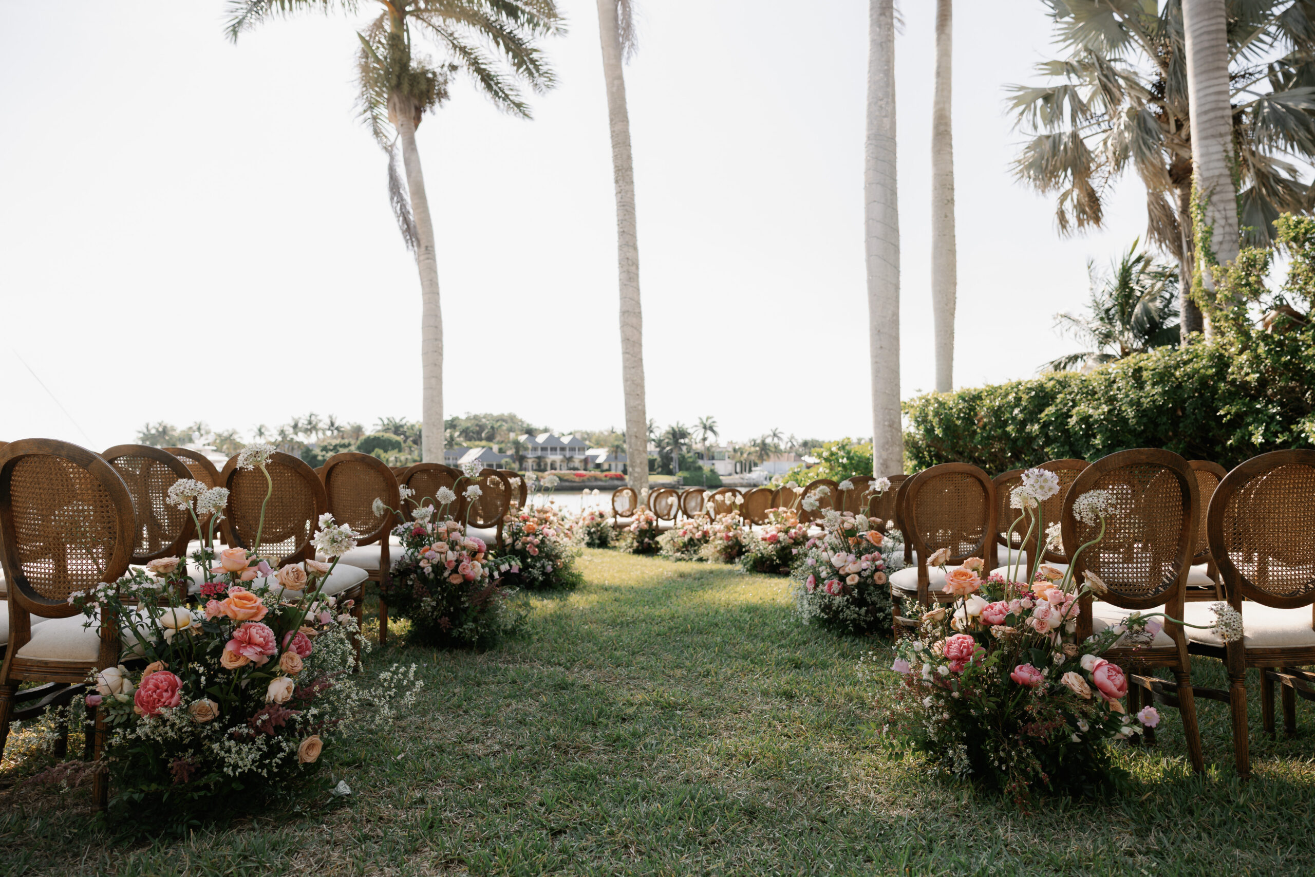 outdoor ceremony floral arrangment by the top wedding florist in naples fl