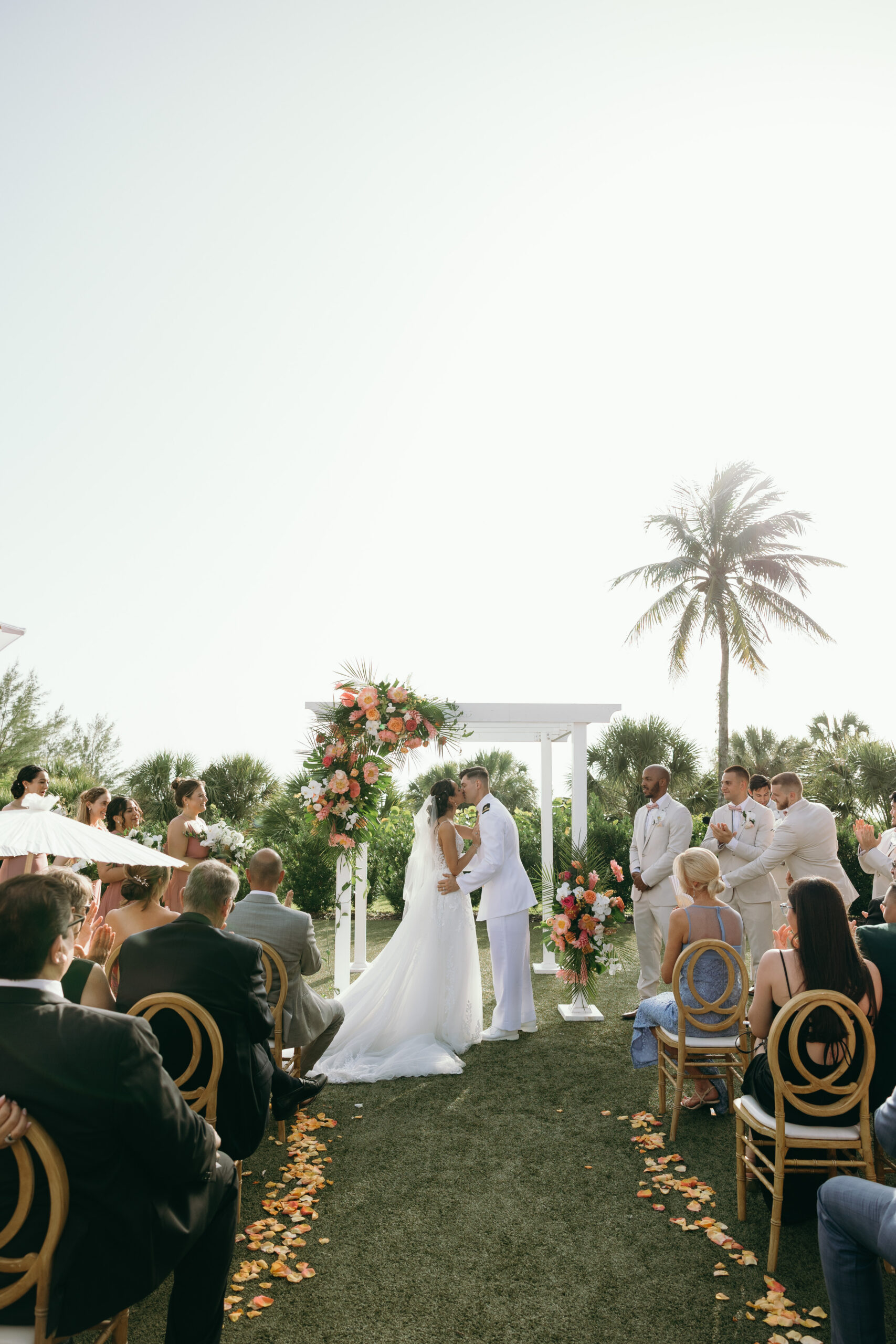bride and groom kissing after getting married in naples